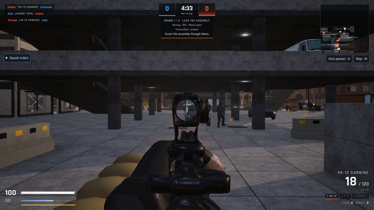 First-person view aiming a carbine with a red-dot sight down a street under an overpass